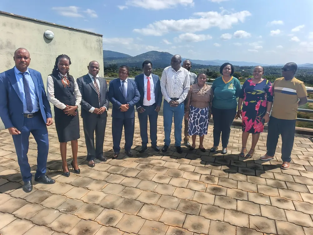 KMUA members during a courtesy call, with the hills of Makueni behind them